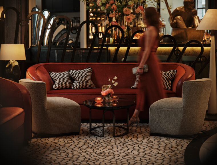 Guest in Lobby Bar at One Aldwych, Covent Garden. Luxury boutique bar with art deco interior.