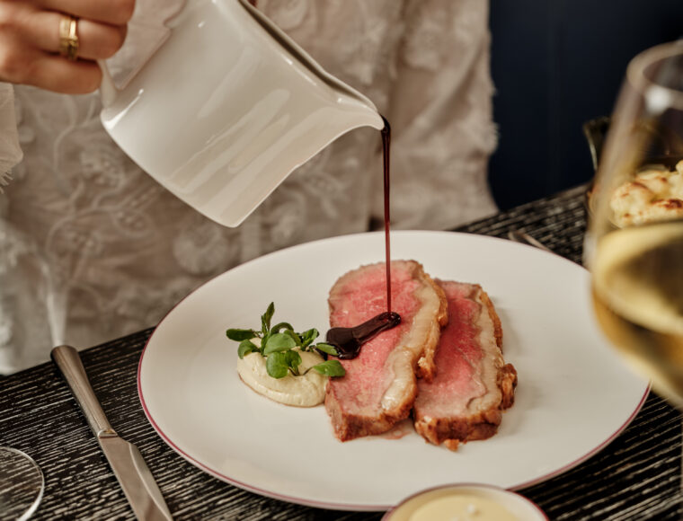 luxury five-star signature restaurant, Indigo's Sunday roast beautifully presented on a fine dining table.