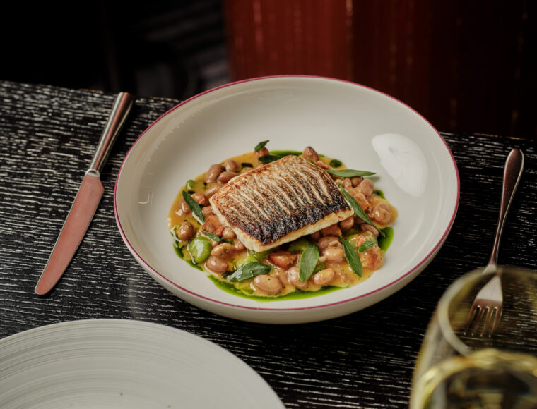 Luxury five-star signature restaurant, Indigo's lunch dishes beautifully presented on a fine dining table.