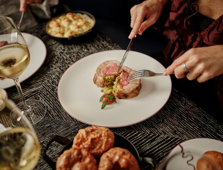 luxury five-star signature restaurant, Indigo's Sunday roast beautifully presented on a fine dining table.